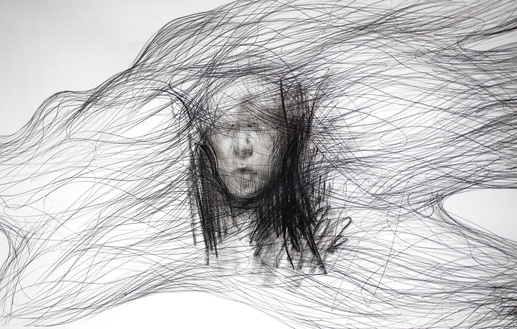 Graphite: a face beneath hair that streams across the whole sheet